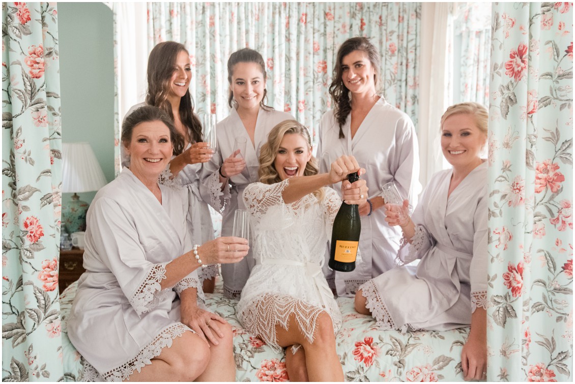 Bridal party opening champagne getting ready | Brittland Manor | Rob Korb | My Eastern Shore Wedding 