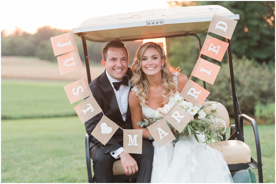 Bride and groom portrait on golf cart with just married sign | Brittland Manor | Rob Korb | My Eastern Shore Wedding 